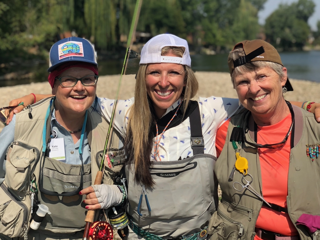 Friends Learning To Fly Fish On A River. Friends Learning To Fly Fish On A River.